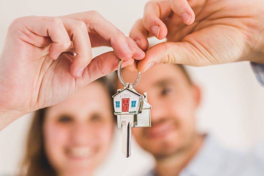 New homeowners receiving the keys to their home